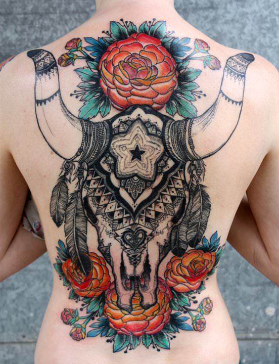 An amazing tattoo design by David Hale that combines an ox skull, mandalas, Native American spirit objects and roses