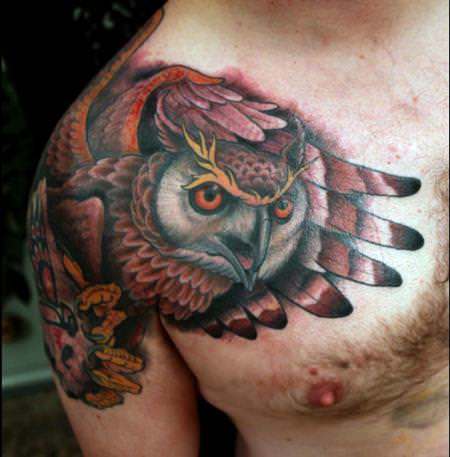 An incredible shoulder tattoo of an owl by painter Shawn Barber