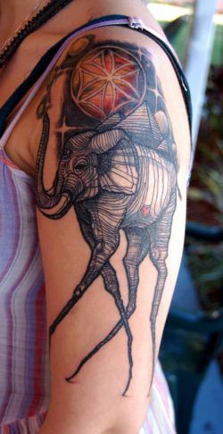 This David Hale tattoo is based on the long legged elephants painted by Salvador Dali