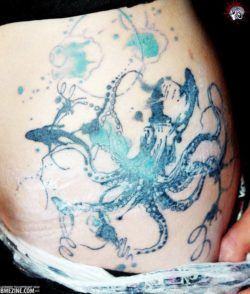 This abstract octopus tattoo design is an example of one of the ways that a tattoo artist can get creative with the shape of an octopus