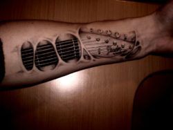 This guy has the tattooed strings of an electric guitar beneath his skin in place of tendons