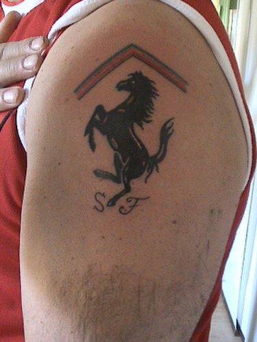 This tattoo of the ferrari logo horse is a celebration of the speed of both horses and racing cars