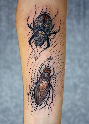 Two beetles cavort in this insect tattoo by David Hale