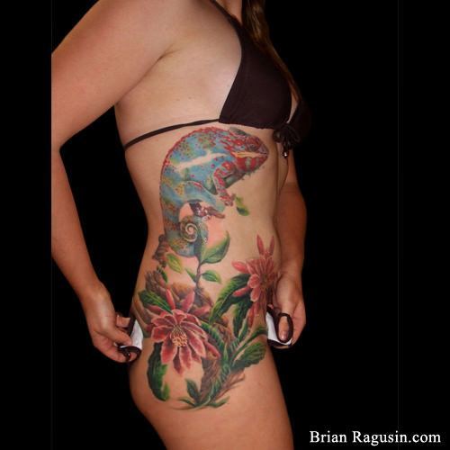 A chameleon and flowers side tattoo by Brian Ragusin