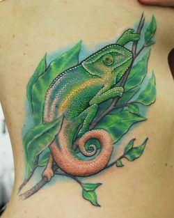 This stylized chameleon tattoo by Josh Hansen shows off the prehensile tail of the chameleon
