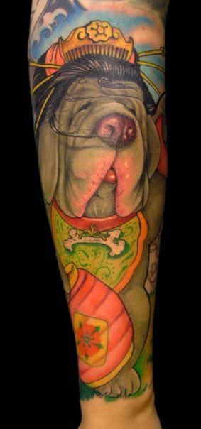 This tattoo of a droopy dog show the influence that Chinese culture has had on Ed Perdomos tattoo art