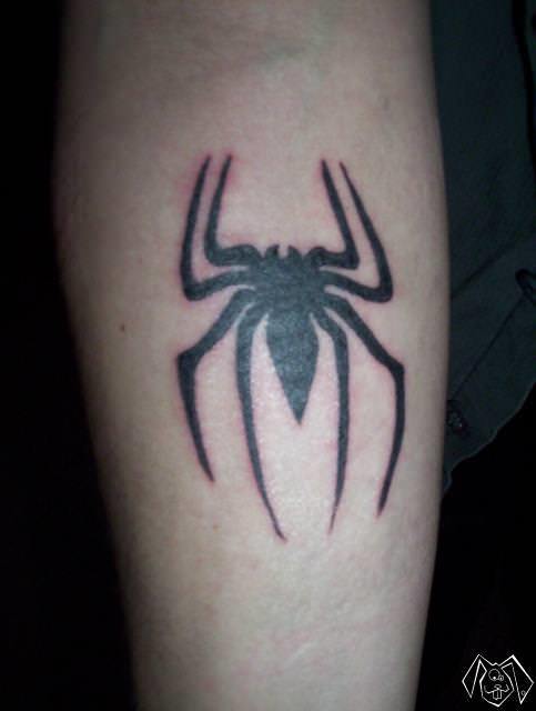 This tattoo shows the spider symbol used for Spiderman