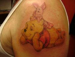 Best friends Winnie the Pooh and Piglet chill out together in this cute tattoo