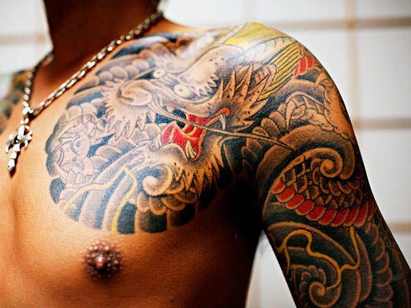 Body modification plays a role in yakuza gang life, including marking the skin with tattoo designs
