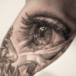 This awesome photo realistic eye tattoo is by Niki Norberg