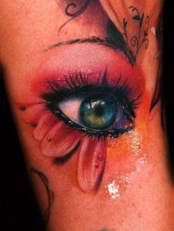 This breathtaking color tattoo design of a photo-realistic eye is by Alex de Pase