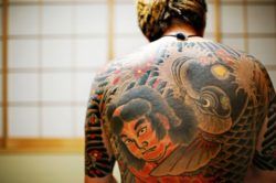 This yakuza tattoo design stops at the neck and elbows so that it can be hidden beneath clothing