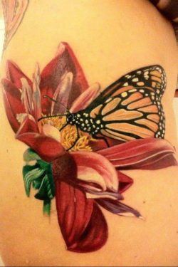 A beautiful butterfly and flower tattoo based on a botanical drawing
