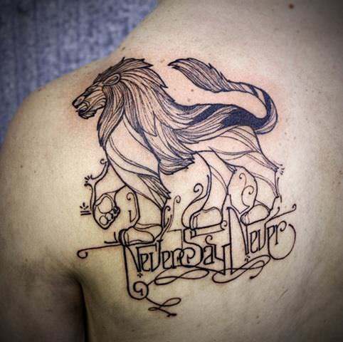 A family crest and motto take on unqiue styling in this heraldry lion tattoo by David Hale