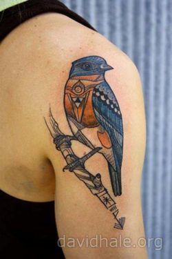 Tattoo artist David hale adds extra symbolism to this totem bird tattoo by giving the bird spiritual designs