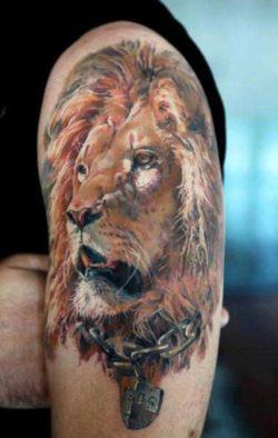 This stunning photo realistic tattoo of a lion symbolizes inner strength about to break free