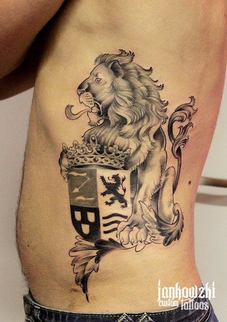 This tattoo of a family crest has the familys symbolic animal, the lion, holding the shield and crown