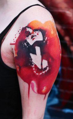 A beautiful woman poses lustily in this red and black tattoo by Ivana Belakova