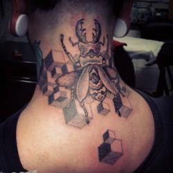 A beetle and optical illusion cubes feature in this dot work tattoo by Gregorio Marangoni