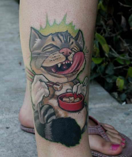 A cartoon cat grins and licks its lips while eating tofu with chopsticks in this cat tattoo design