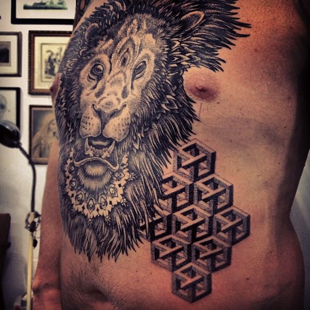 A lion, mandala and impossible object illusions combine in this pointillism tattoo by Gregorio Marangoni