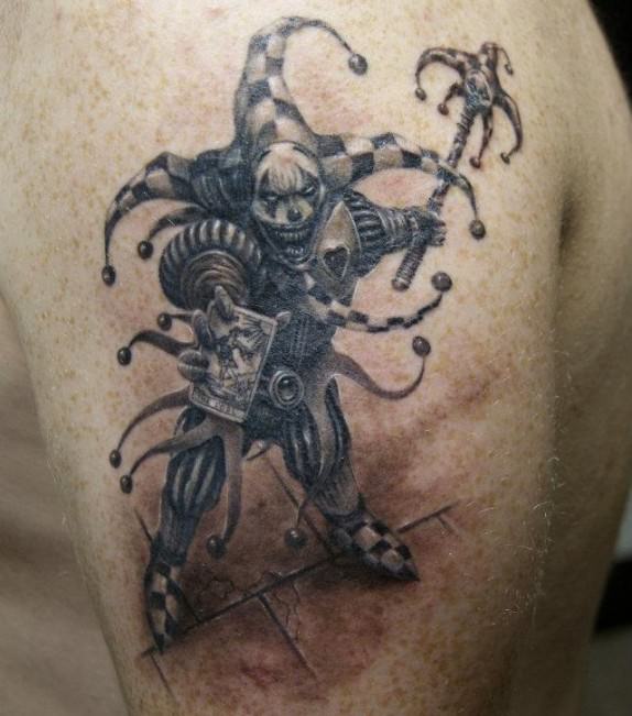 A medieval fantasy jester gets an evil grin in this black and white tattoo by Robert Litcan