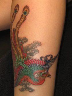An Asian peacock takes on a Japanese style in this bird tattoo by Hide Ichibay