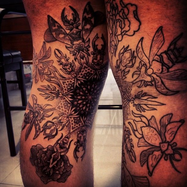 Beetles converge to create a madala flower in this dotwork tattoo design by Gregorio Marangoni
