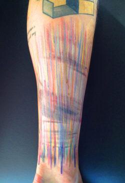 Colorful sktechy lines look drawn onto skin in this artistic abstract tattoo by Amanda Wachob