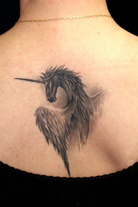 Robert Litcan shows off his photo realism skills with this fantasy tattoo of a winged unicorn