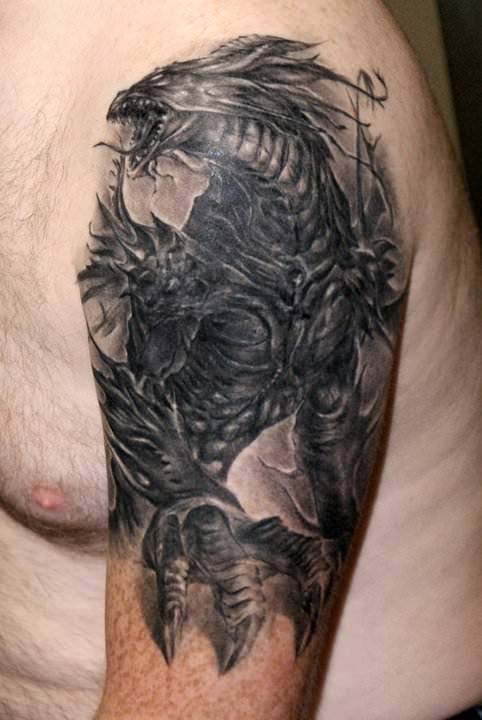 Robert Litcan uses perspective in this fantasy tattoo to make the dragon seem even more imposing
