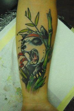Tattoo artist Jukan combines humor and animal symbolism in this tattoo of a ninja panda bear