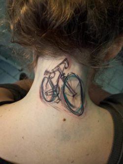 Tattoo artist Sven Groenewald from Berlin creates a bicycle body art work