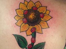 This cute sunflower and ladybug tattoo design is in the style of a childrens book illustration