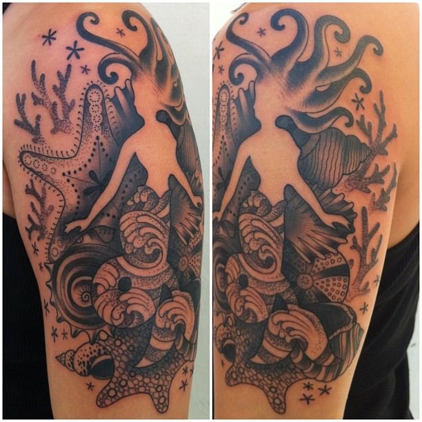 Tattoo artist Gemma Pariente creates an artistic and feminine design of a mermaid with seashells
