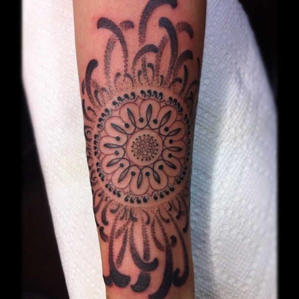 This beautiful mandala flower tattoo by Gemma Pariente is both feminine and spiritual