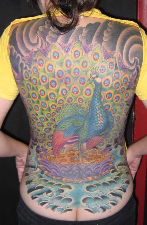This full back tattoo combines the Asian peacock bird with elemental designs in an Asian style