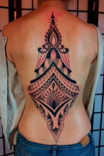This geometric back tattoo by Gemma Pariente is both feminine and spiritual