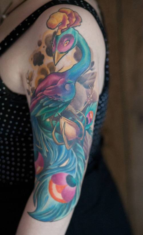 This new school peacock tattoo has a modern, playful feeling about it