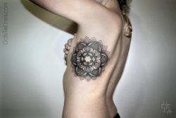 Chaim Machlev creates a feminine mandala flower tattoo out of spiritual saced geometry