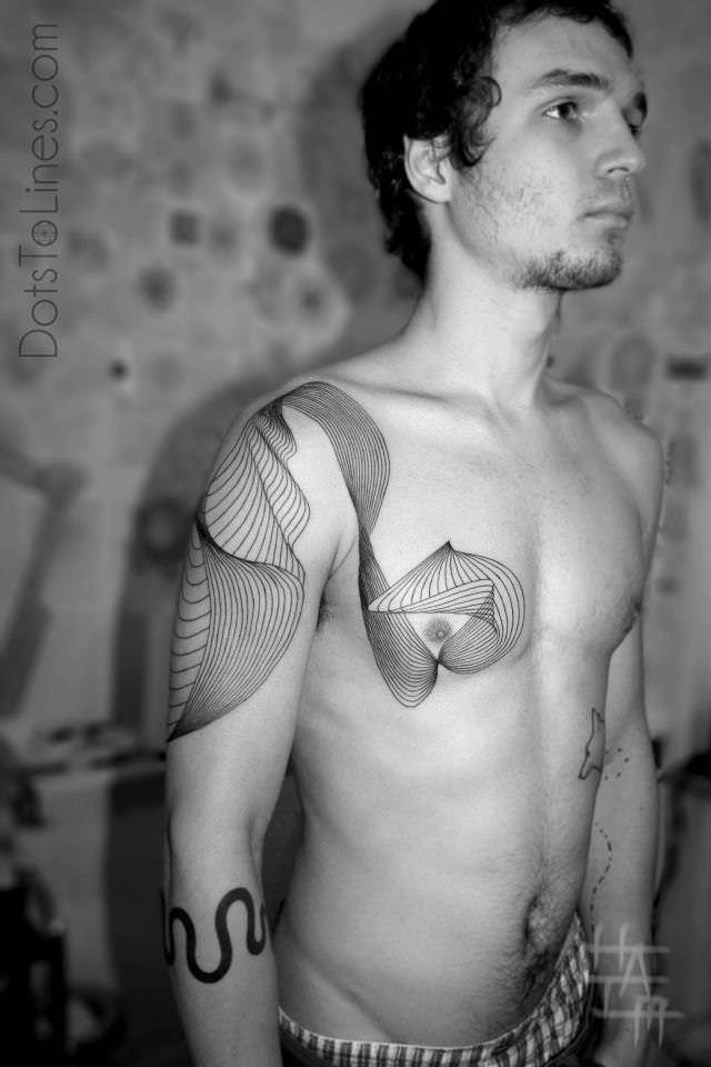Chaim Machlev gives this geometric tatto an organic apeal with flowing lines
