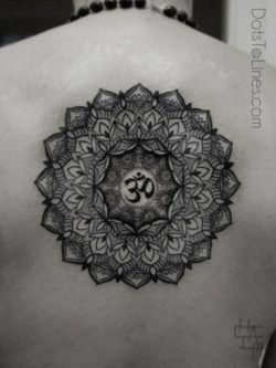 Chaim Machlev uses the ohm symbol for spirituality in this dotwork mandala flower tattoo