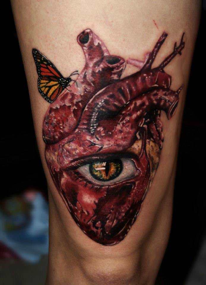 Inspired by Salvador Dali, Carlox Angarita has created a surrealist tattoo of a human heart, eye and butterfly