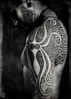 Peter Madsen creates an abstract octopus tattoo with sacred geometry designs