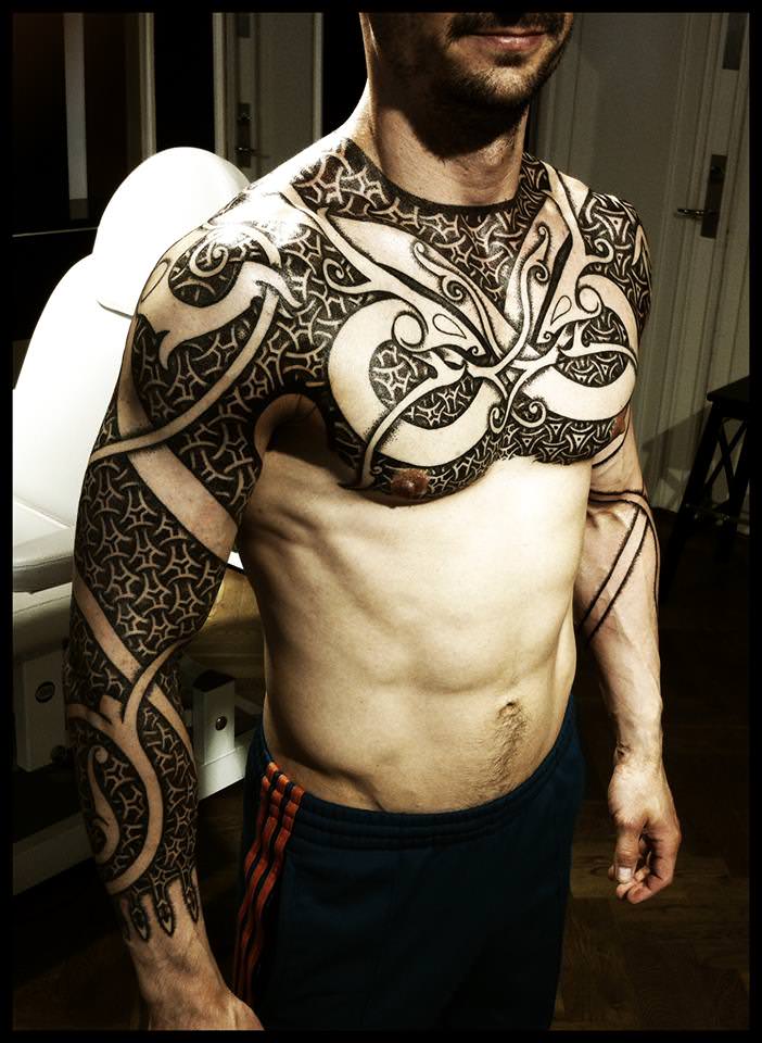 Peter Madsen's tribal tattoo style is an ideal choice for MMA fighters and other athletes
