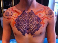 Peter Walrus Madsen prefers to create his spiritual, tribal tattoos direcly on the client to honor the shape of the body