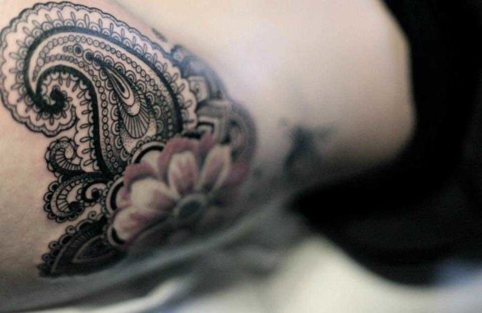 A close up photo of this feminine paisley tattoo by Dodie reveals the depth of detail in the tattoo design