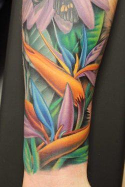 Whether alone or in a busy scene, the bird of paradise flower makes an eye catching tattoo design