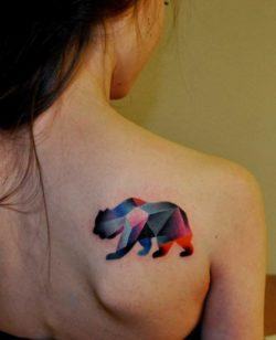 A cubist bear honors 20th century art in this artistic animal tattoo by Marcin Surowiec