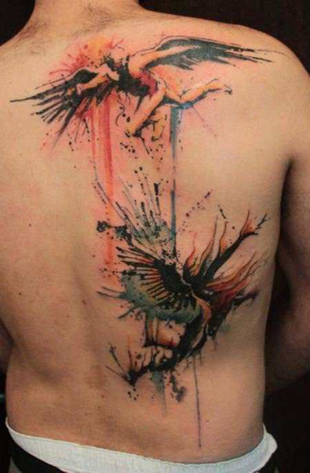 Angels battle in this watercolor tattoo by Gene Coffey that shows brush strokes and splatters